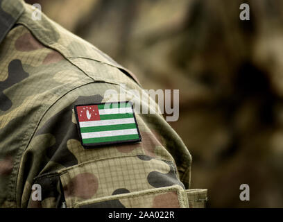 Drapeau de la République d'Abkhazie sur l'uniforme militaire. Les forces armées, l'armée, des soldats. Collage. Banque D'Images