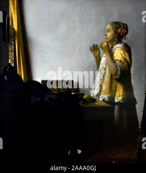 Jeune femme avec collier de perles 1662-1665 par Johannes Vermeer 1632 - 1675 pays-Bas, néerlandais, ( peintre hollandais dans l'âge d'or, un des plus grands peintres, 17th siècle. des moments intemporels et subdulés préférés, des couleurs énigmatiques et inimitables, ainsi qu'un contenu de lumière déconcertant) Banque D'Images