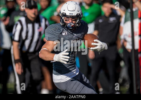 Houston, TX, USA. 23 Nov, 2019. Les hiboux de riz américain Austin Trammel (10) s'exécute après avoir fait une prise au cours du 1er trimestre d'un NCAA football match entre la North Texas Mean Green et le Riz Le riz à chouettes Stadium à Houston, TX. Le riz a gagné le match 20 à 14.Trask Smith/CSM/Alamy Live News Banque D'Images