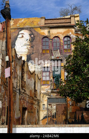 L'art mural par El Nino de las pinturas autour de Joe Strummer Plaza dans la ville de Grenade, Andalousie, Espagne Banque D'Images