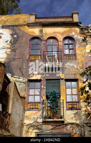 L'art mural par El Nino de las pinturas autour de Joe Strummer Plaza dans la ville de Grenade, Andalousie, Espagne Banque D'Images