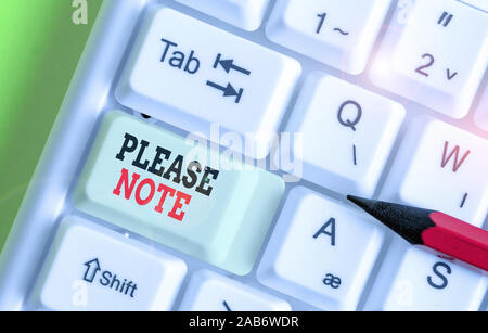 Écrit remarque montrant Veuillez prendre note. Concept d'affaires de façon formelle pour diriger montrant s est l'attention sur certaines informations Banque D'Images