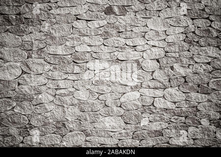 La texture de fond de mur de pierre grise avec vignette, photo en noir et blanc Banque D'Images