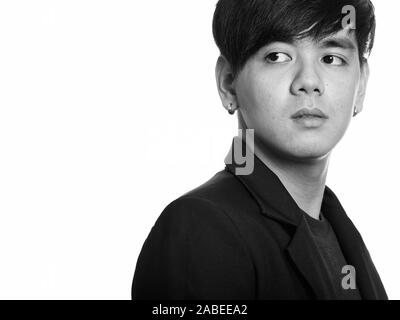 Studio shot of cool bel asiatique businessman looking back Banque D'Images