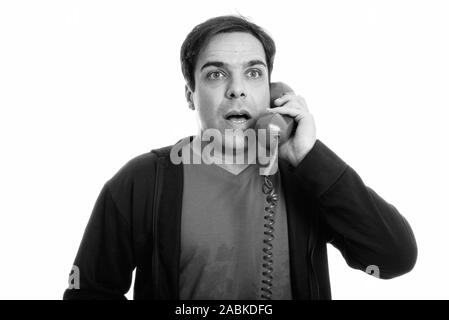 Close up of young man persan vieux téléphone tout en regardant choqué Banque D'Images