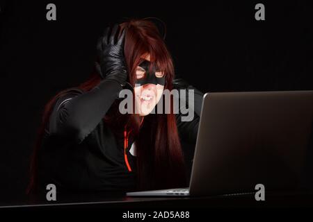 Happy hacker dans black mask Banque D'Images