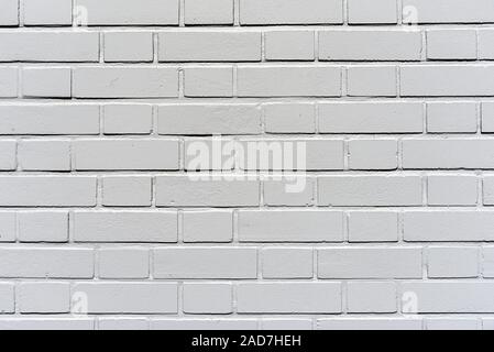 Arrière-plan d'un mur en brique de plâtre gris Banque D'Images