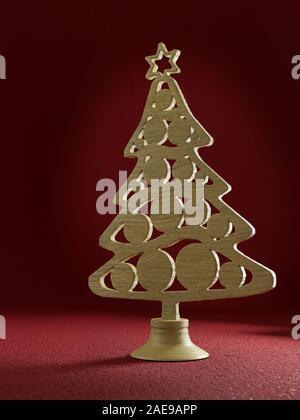 Ornement en bois d'arbre de Noël de coupure sur le stand sur fond rouge foncé Banque D'Images