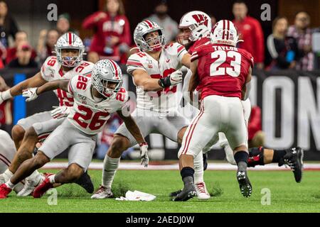 Indianapolis, Indiana, USA. 7 Décembre, 2019. Wisconsin Badgers running back Jonathan Taylor (23) porte le ballon dans la deuxième moitié du match entre le Wisconsin Badgers et l'Ohio State Buckeyes au Lucas Oil Stadium, Indianapolis, Indiana. Crédit : Scott Stuart/ZUMA/Alamy Fil Live News Banque D'Images