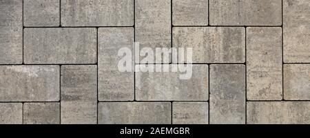 Blocs de forme régulière, la texture, l'arrière-plan. Dalles de blocs gris de forme plate, close-up. Un nouveau revêtement dans le parc de la ville Banque D'Images