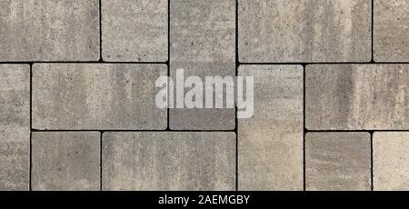 Blocs de forme régulière, la texture, l'arrière-plan. Dalles de blocs gris de forme plate, close-up. Un nouveau revêtement dans le parc de la ville Banque D'Images