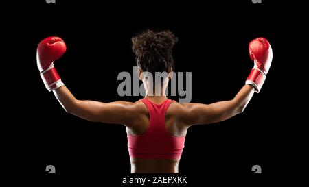 Boxing chamion afro girl raising her hands up Banque D'Images