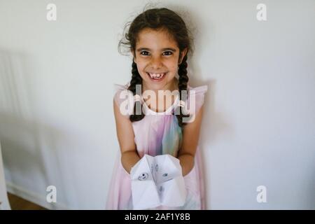 Girl holding paper fortune teller Banque D'Images