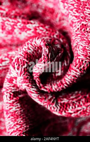 Chandail tricoté Contexte tordu en spirale.. Rose blanc motif tacheté. La surface du visage. Copy space Banque D'Images