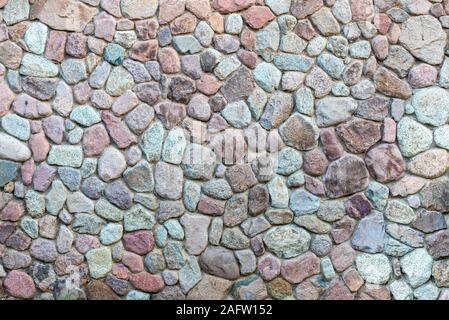 La texture du mur de pierre. La conception de la surface du mur en pierre décorative avec du ciment. Fond naturel de rocher. Banque D'Images