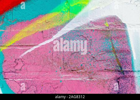 Fragment de graffitis colorés peints sur un mur de briques. La texture. Résumé fond pour la conception. Banque D'Images