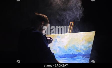 Seascape peinture artiste copiste avec navire dans l'océan. La fumée de Vaper vape e-cigarette. Artisan décorateur dessiner comme bateau sur la mer bleu avec la couleur acrylique. Banque D'Images