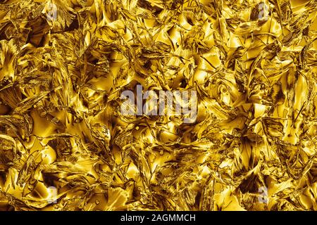 Résumé fond métallique brillant d'or, art gold couleurs flou des pétales de toile, jaune brillant, texture de décoration fête vacances frame Banque D'Images