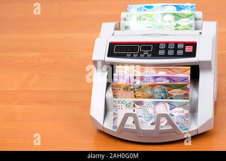 Dollar barbadien dans une machine de comptage Banque D'Images