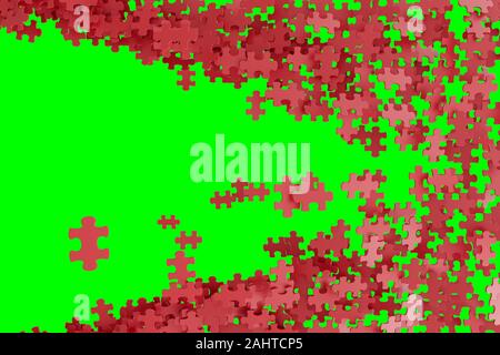 Pièces de puzzle éparpillés sur une partie gauche d'un écran vert. Banque D'Images