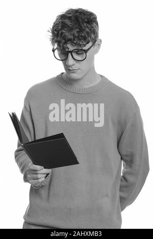 Beau jeune homme nerd avec cheveux bouclés portant des lunettes Banque D'Images