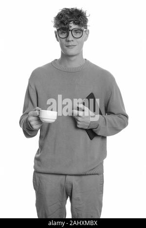 Beau jeune homme nerd avec cheveux bouclés portant des lunettes Banque D'Images