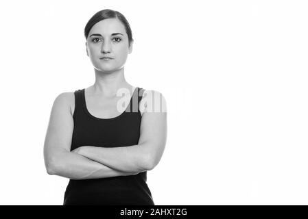 Studio shot of woman with arms crossed Banque D'Images