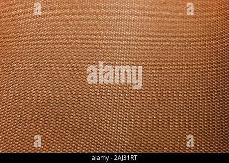 Close-up of orange télévision abstraite texturée haute détail tissu de vêtements de couleur et en partie à la lumière des réflexions réalistes Banque D'Images