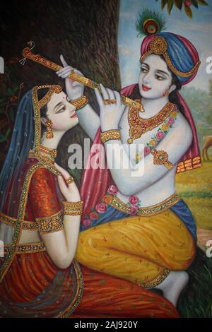 Le Seigneur Krishna jouant le bansuri (flûte indienne) à Radha Banque D'Images