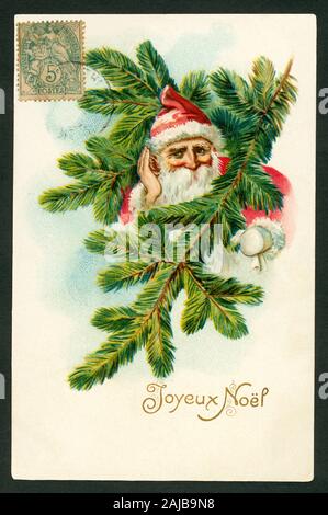 Europa, Frankreich, französische Weihnachtskarte mit dem Text ' Joyeux Noel ' ( Fröhliche Weihnachten ) , der Weihnachtsmann schaut durch Tannenzweige hindurch, wurde verschickt 1909 . / Europe, France, Français Carte de Noël avec le texte ' Joyeux Noel ' ( ) Joyeux Noël , le Père Noël en voyant à travers quelques branches de sapin, a envoyé 1909 . Banque D'Images