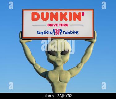 Étranger porteur d'inscrire Connexion au Dunkin Donuts sur Main Street dans le centre-ville de Roswell, Nouveau Mexique Banque D'Images