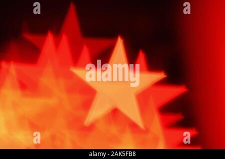 Bokeh abstract shapes Red star blur. Noël arrière-plan. Banque D'Images