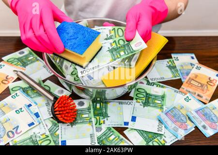 Photo symbole blanchiment, les billets sont lavés, Allemagne Banque D'Images