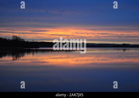 Le lever du soleil, Lochmaben, près de Lockerbie, Dumfries et Galloway, Écosse Banque D'Images