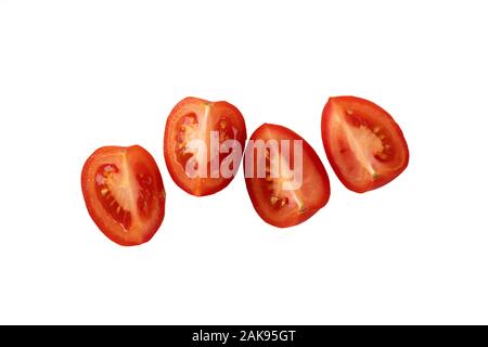 Quarts de tomate. rouge juteuse de tranches de tomate. Banque D'Images