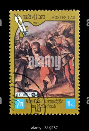 Timbre-poste annulé imprimé par le Laos, qui montre la peinture à des motifs religieux par Corregio, vers 1984. Banque D'Images