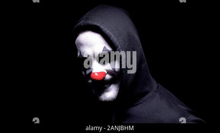 Clown fou Smiling at camera, terrible cauchemar, phobie peur concept Banque D'Images