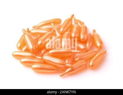 Pile de capsules en plastique orange isolated on white Banque D'Images