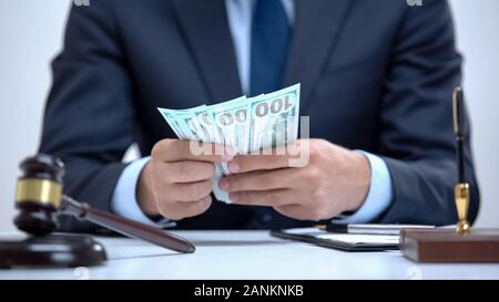 Avocat comptant de dollars, les activités commerciales illégales, des services coûteux Banque D'Images