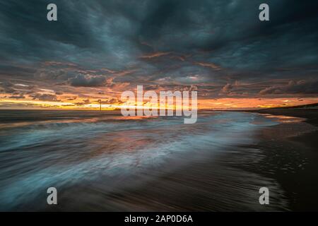 Sur le sceau Palling North Norfolk Coast comme le soleil se lève. Banque D'Images