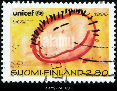 POLTAVA, UKRAINE - le 20 janvier 2020. Vintage de timbres en Finlande circa 1996 montrent des Nations Unies pour l'enfance 50ème anniversaire Banque D'Images