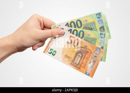 Main contenant des billets EUR. Monnaie européenne, concept de salaire ou de prêt, isolé à la main Banque D'Images