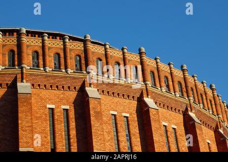 Vue extérieure d'un ancien bâtiment de porte-gaz en brique rouge. Banque D'Images