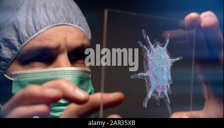 Expert scientifique en quarantaine inspectant une image tridimensionnelle du Coronavirus COVID-19 à la recherche d'un vaccin. Banque D'Images