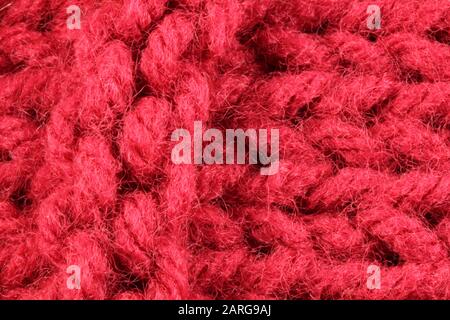 Gros Plan Sur La Texture De La Maille Du Pull De Bourgogne Banque D'Images