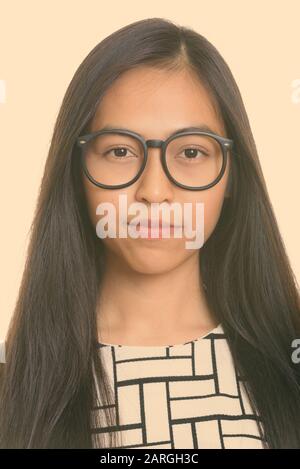 Face of young Asian teenage girl nerd Banque D'Images