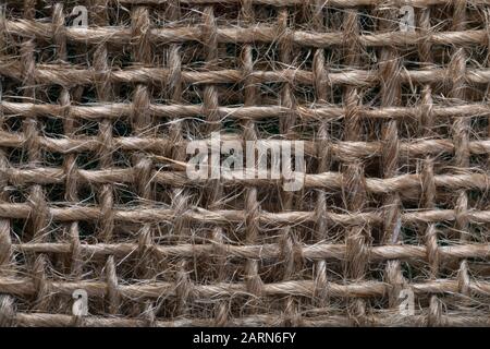 Texture du tissu lin, gros plan. Fond avec trous dans le tissu. Banque D'Images