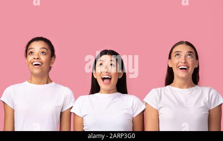 Génial. Trois Filles Excitées Regardant Debout, Studio Shot Banque D'Images