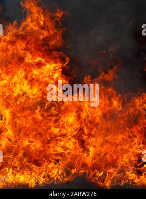 La texture abstraite de flamme de feu de feu sur fond sombre Banque D'Images