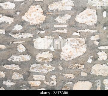 Fragment d'un ancien mur de pierre à Chypre, arrière-plan Banque D'Images